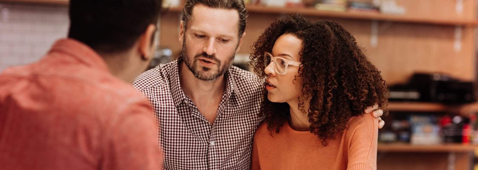 a man and woman looking at each other