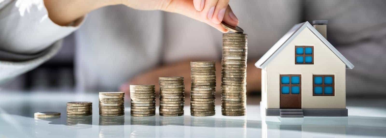 a hand stacking coins