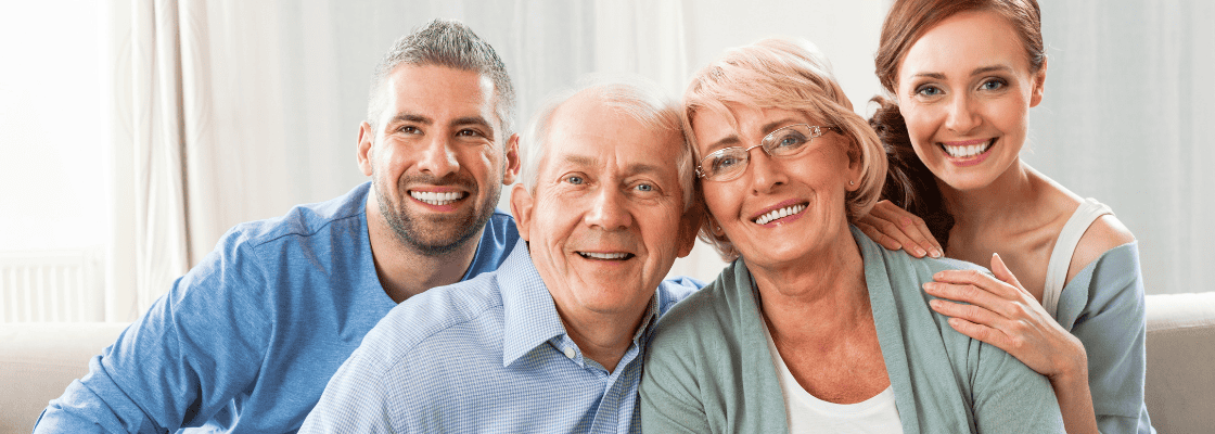 a group of people smiling for a photo